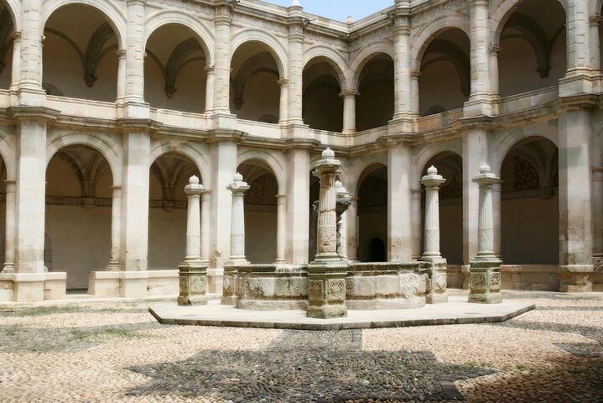 a large building with columns and arches on it