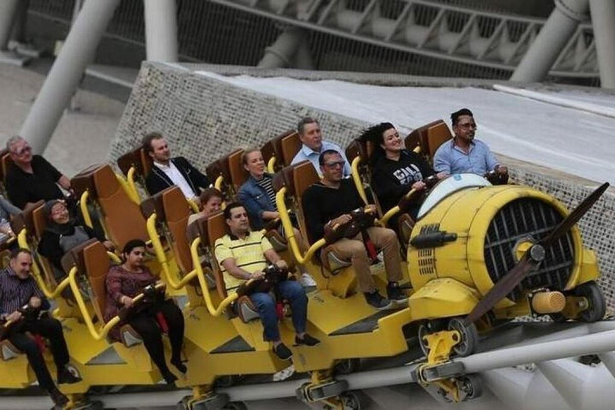 a group of people sitting on a fake train