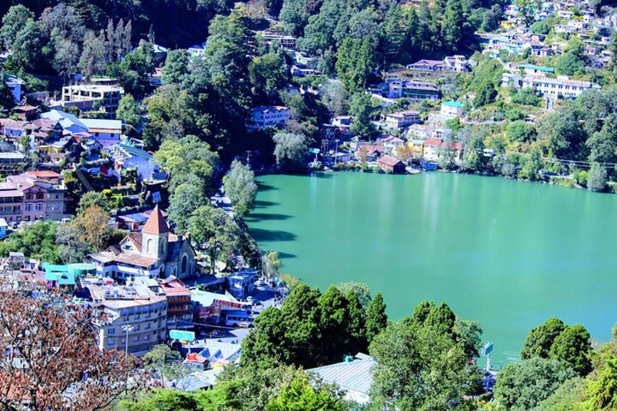 an aerial view of a town with a lake