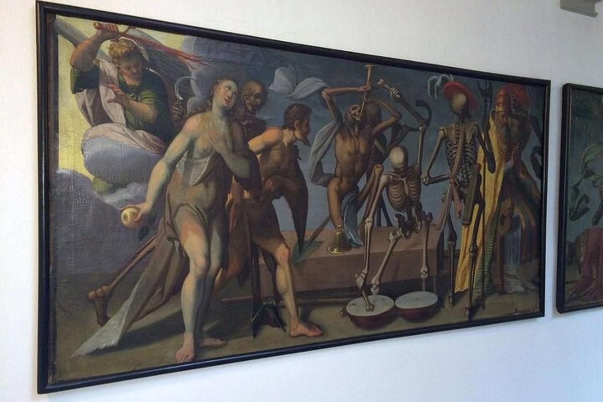 μια ζωγραφιά μιας ομάδας ανθρώπων σε έναν τοίχο