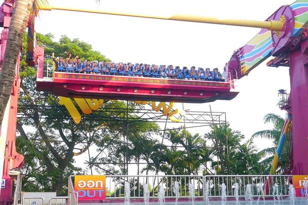 a group of people riding on a roller coaster