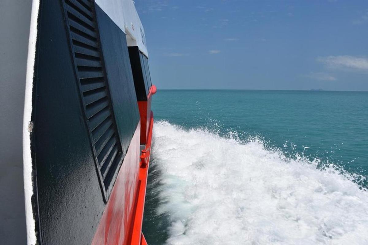 a view from the side of a boat in the ocean
