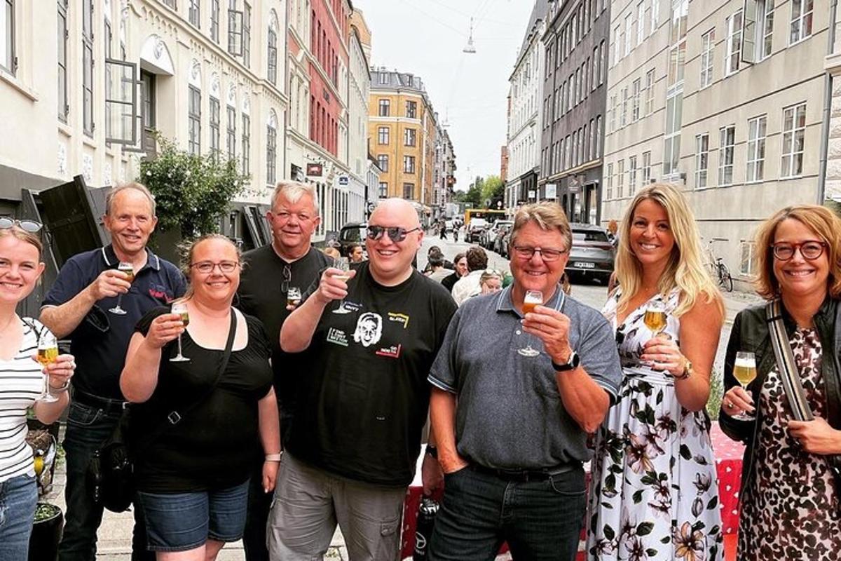 a group of people standing on a street holding wine glasses
