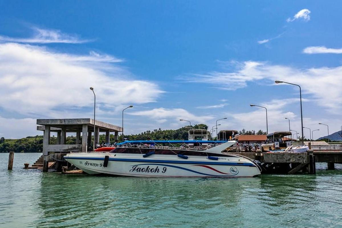 a boat is docked next to a pier