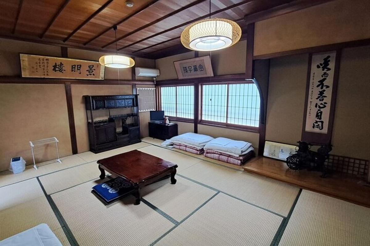 a room with two beds and a table in it