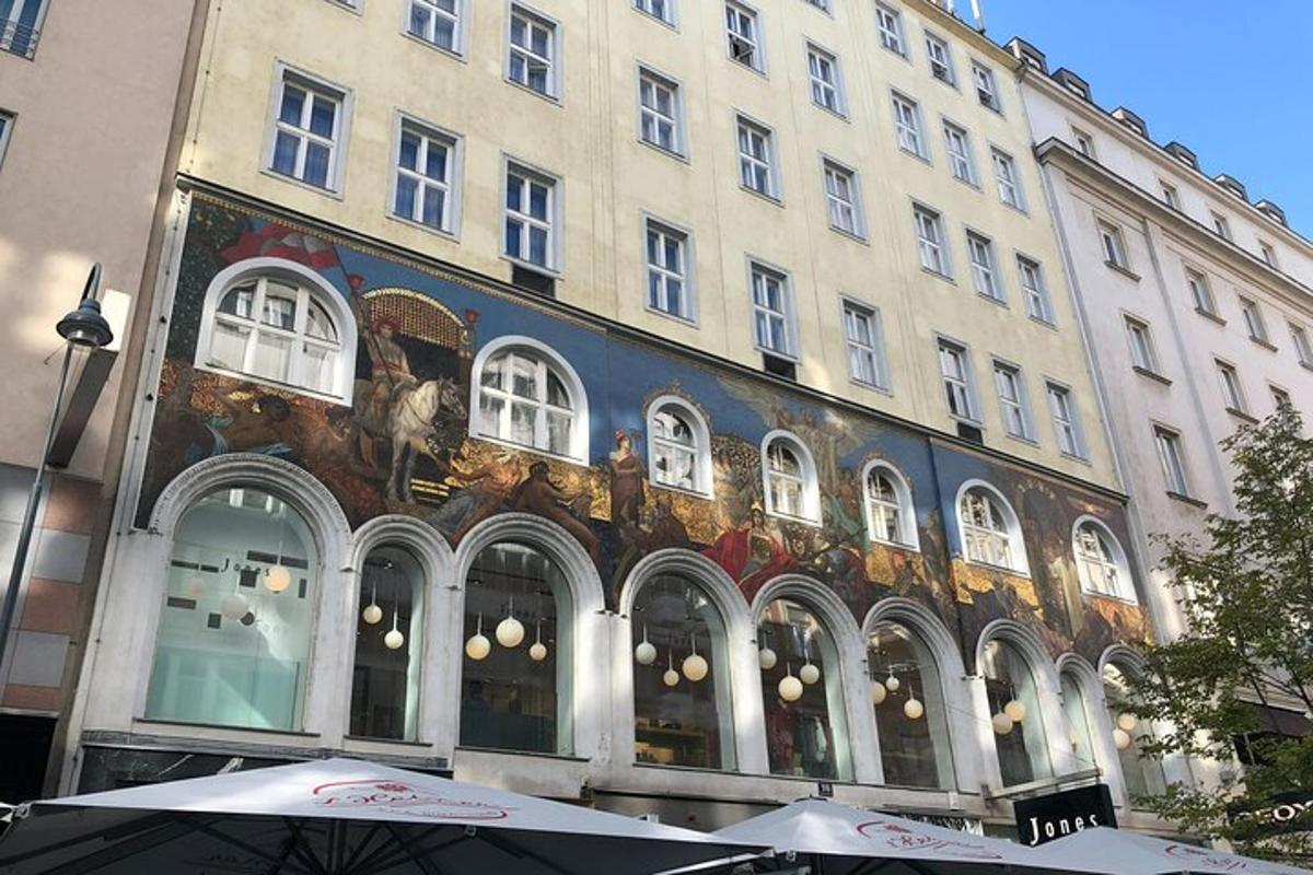 a large building with umbrellas in front of it