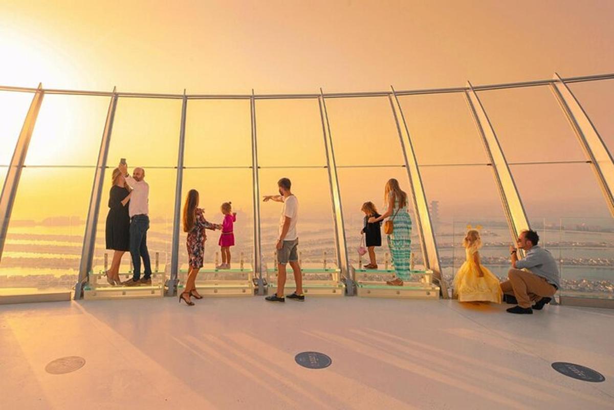 a group of people standing on the top of a building
