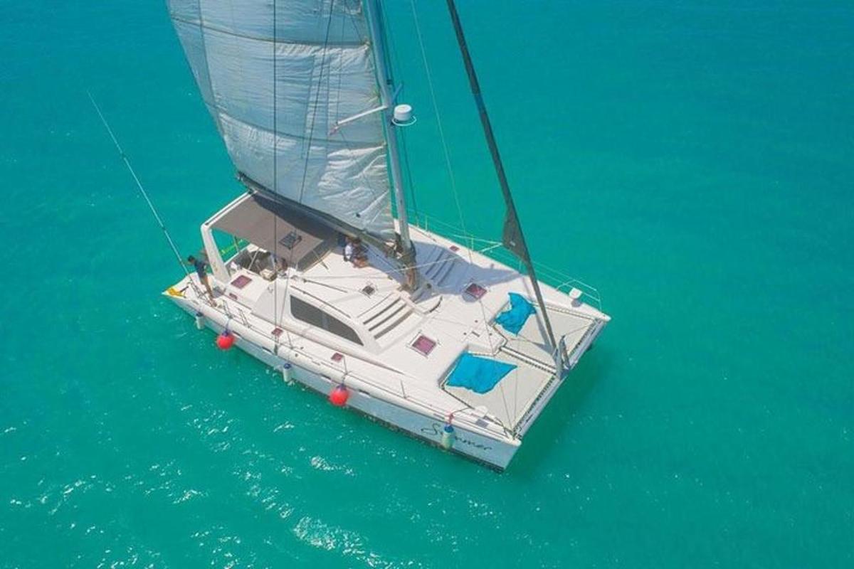 a white sailboat in the water on the ocean