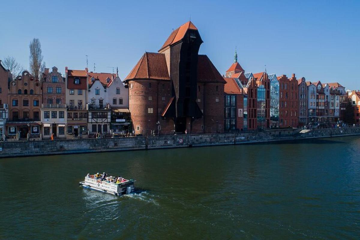 a boat in a river in front of a city