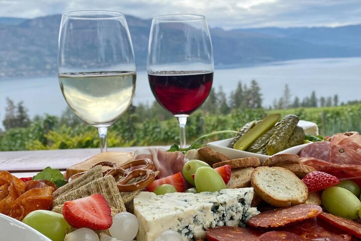 a plate of food with two glasses of wine