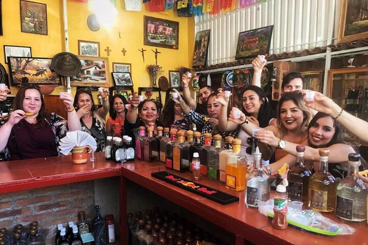 a group of people sitting at a bar with their hands up