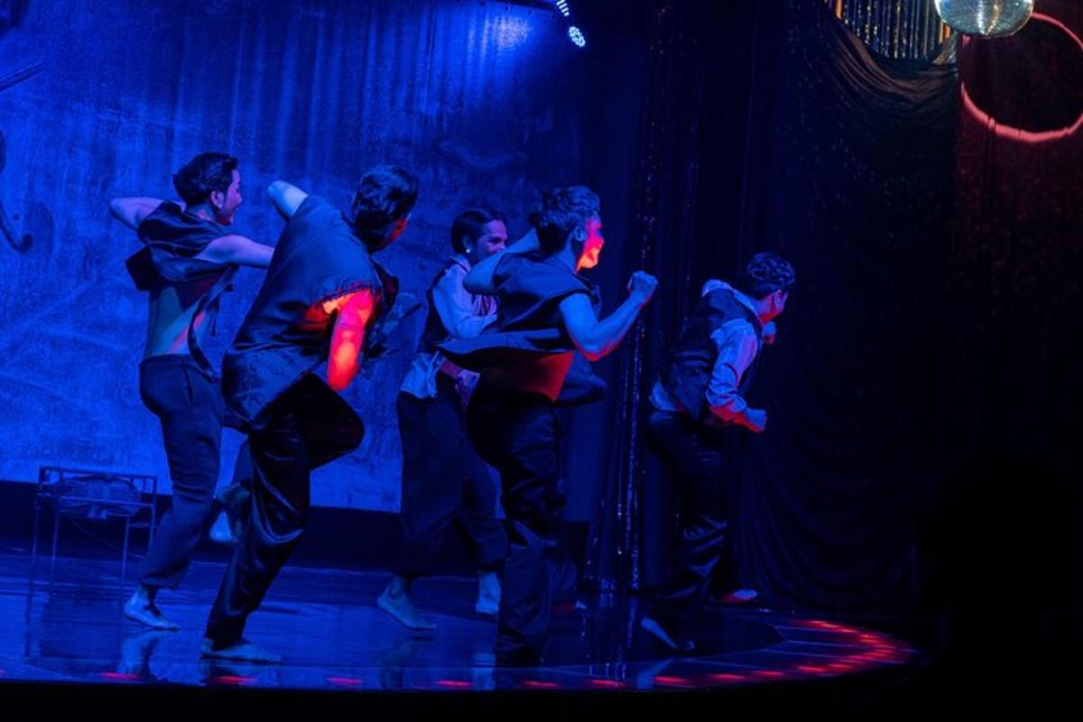 a group of people dancing on a stage