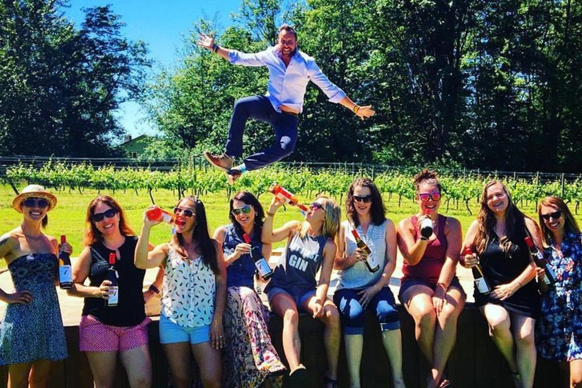 a man jumping in the air over a group of people