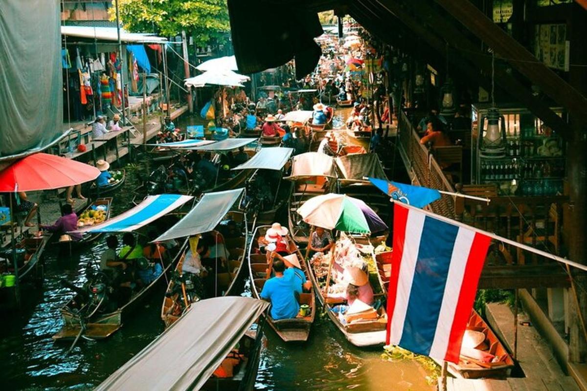 a group of boats in the water with umbrellas