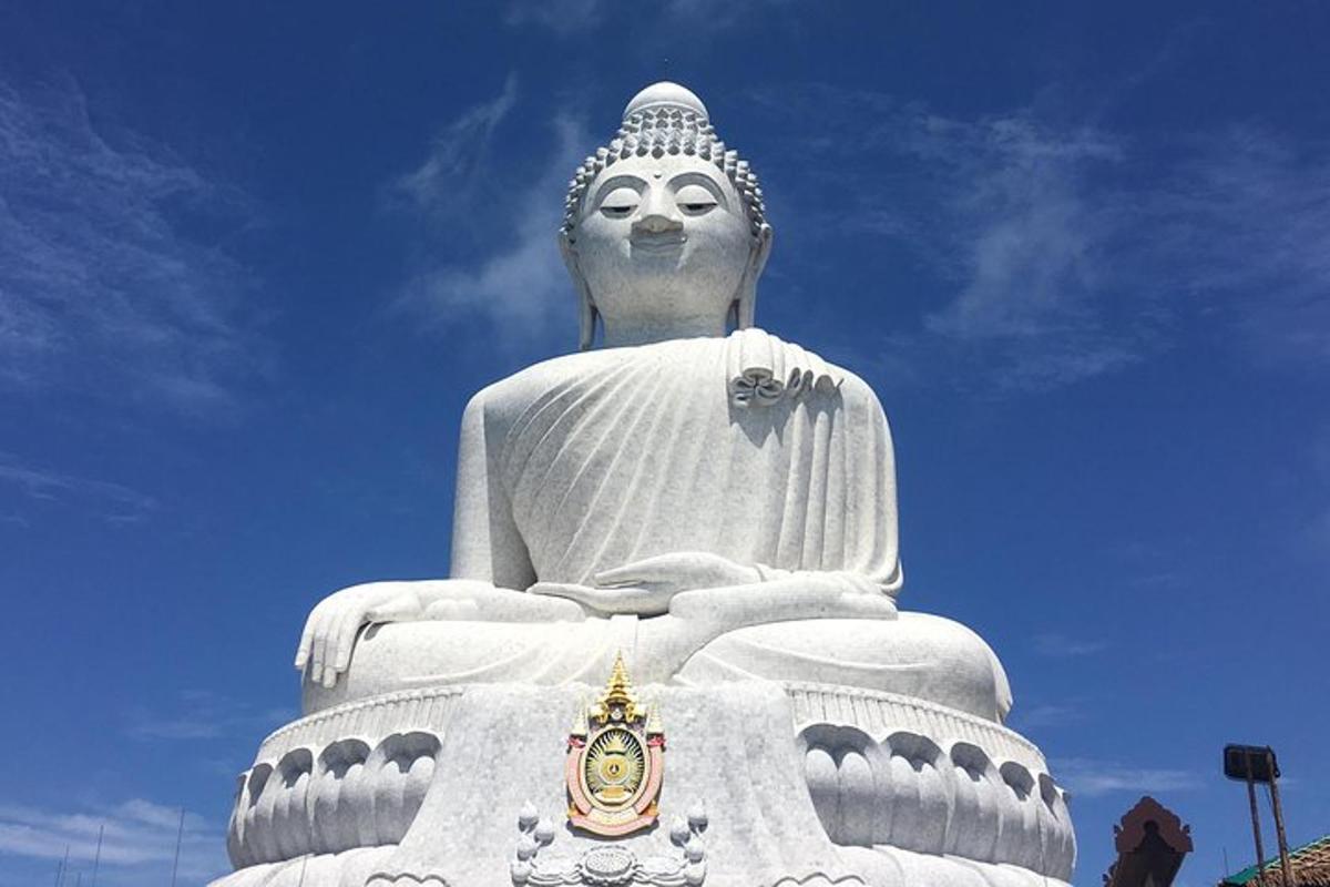 a large white statue of a large buddha
