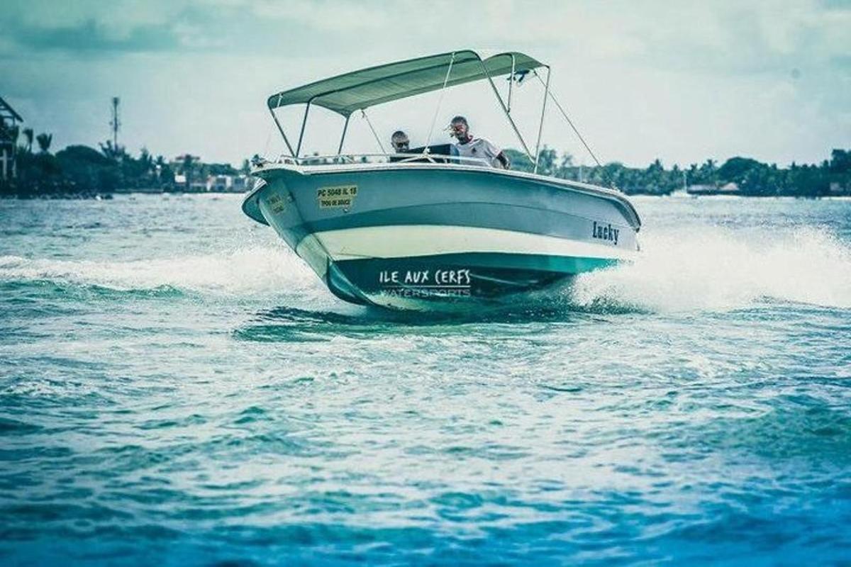 two people riding on a boat in the water