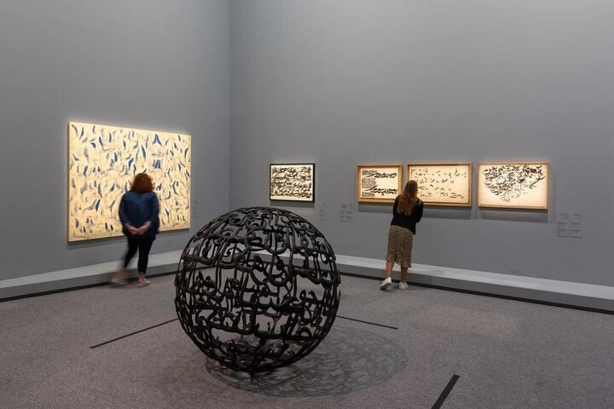a group of people looking at art in a museum