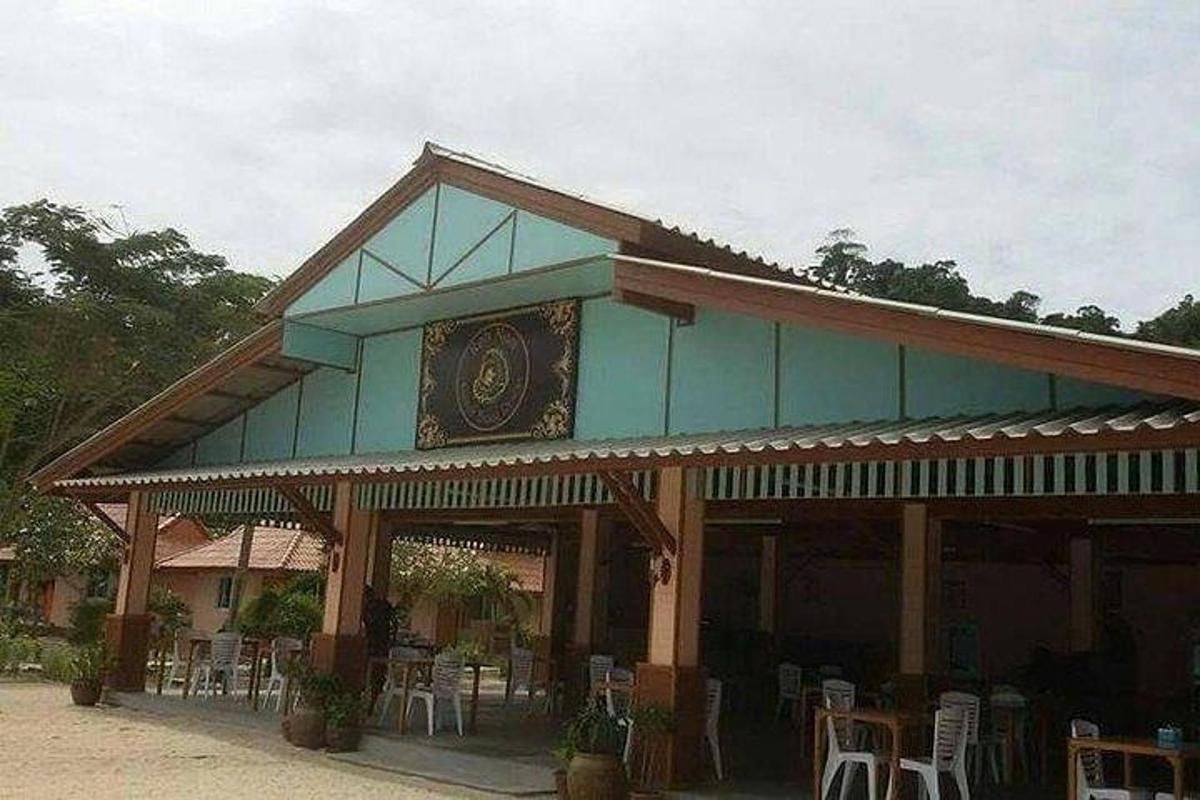 a building with tables and chairs in front of it
