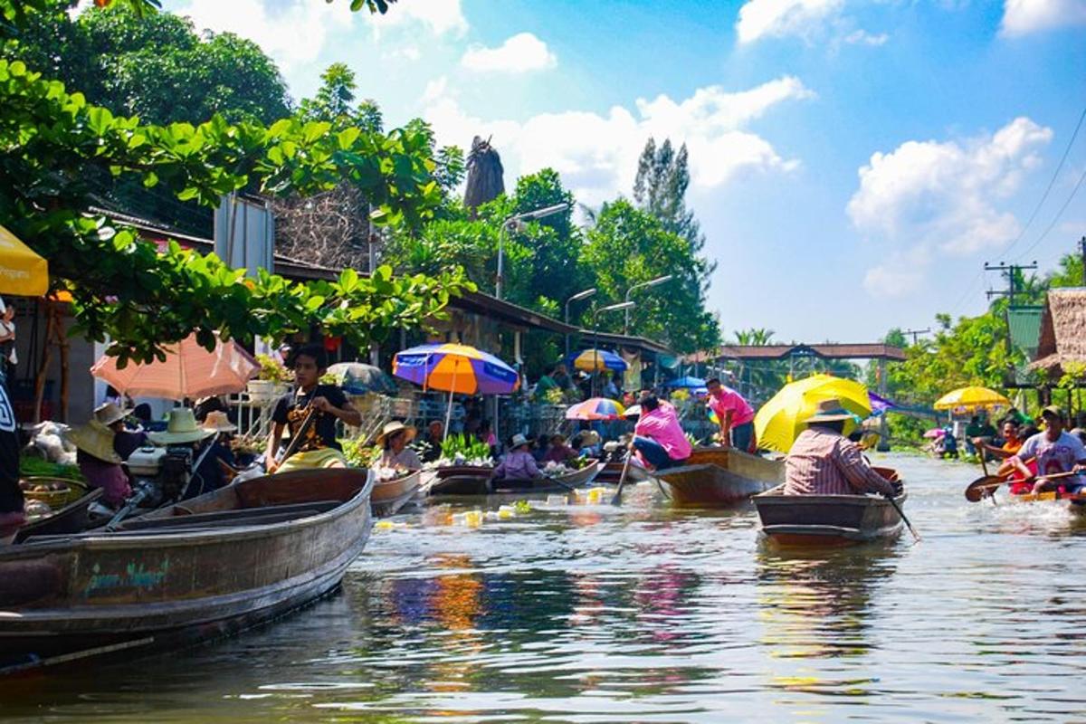 a group of people in boats on a river with umbrellas