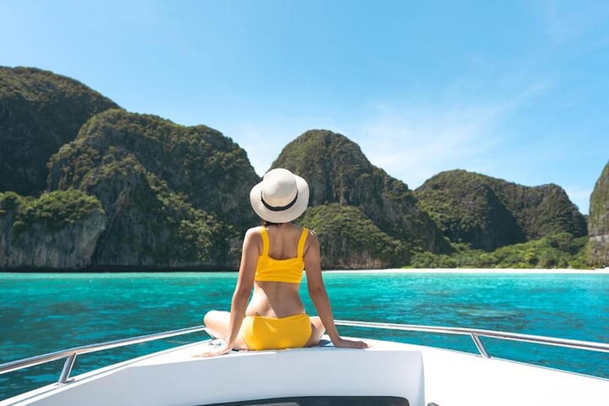 a woman sitting on the back of a boat in the ocean