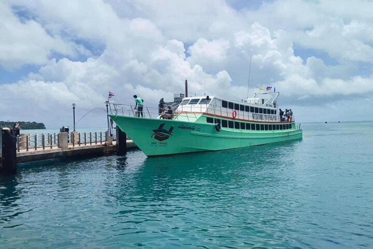 a ferry boat is docked at a dock
