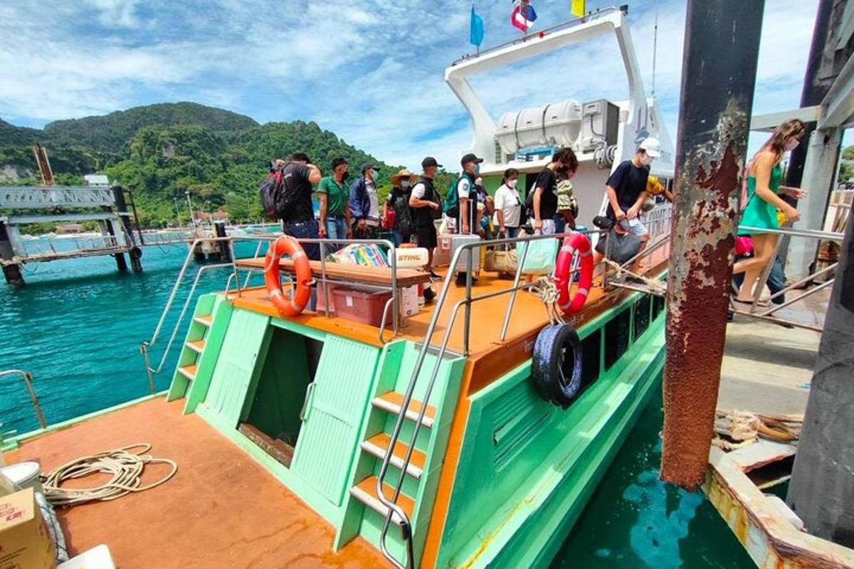 a group of people on a boat in the water
