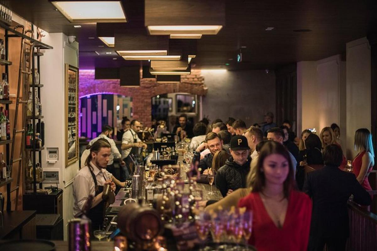 a group of people sitting at a bar