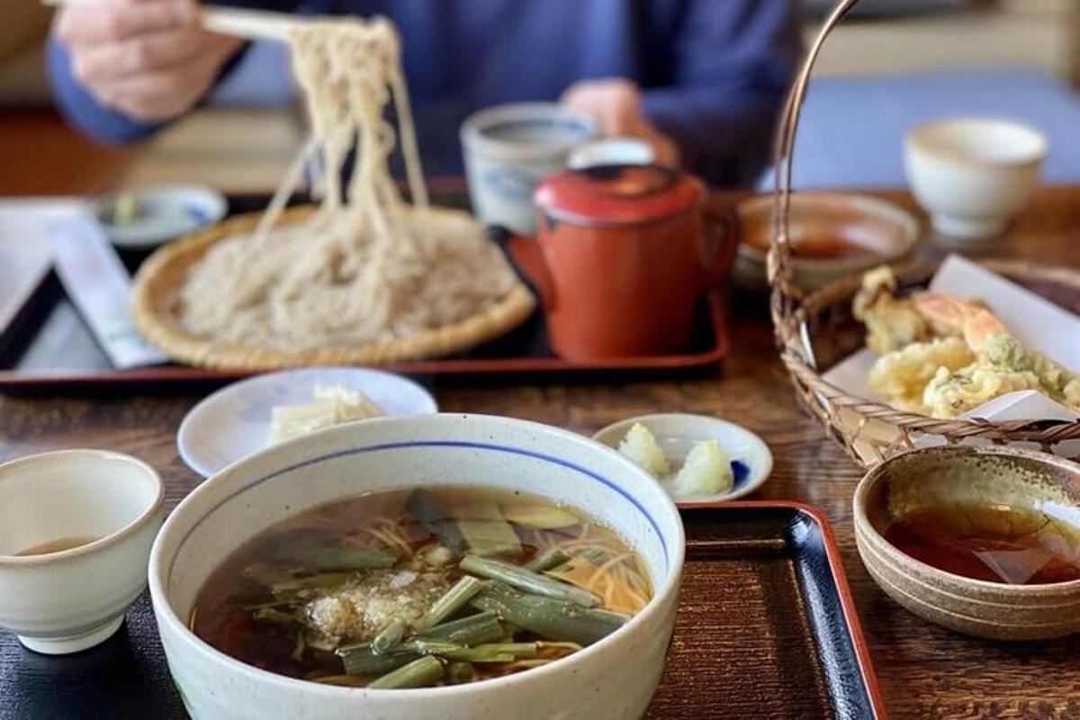 a table with a bowl of soup and a plate of food