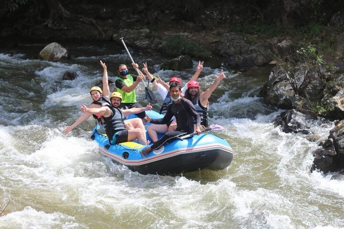 a group of people on a raft in a river