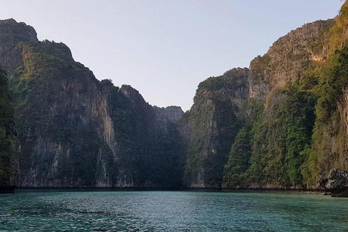 a large body of water in front of some mountains
