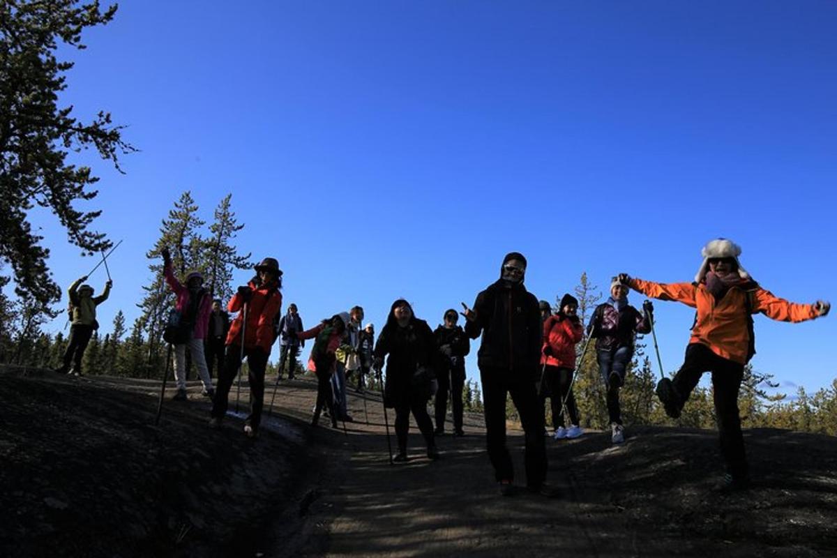 a group of people walking up a hill