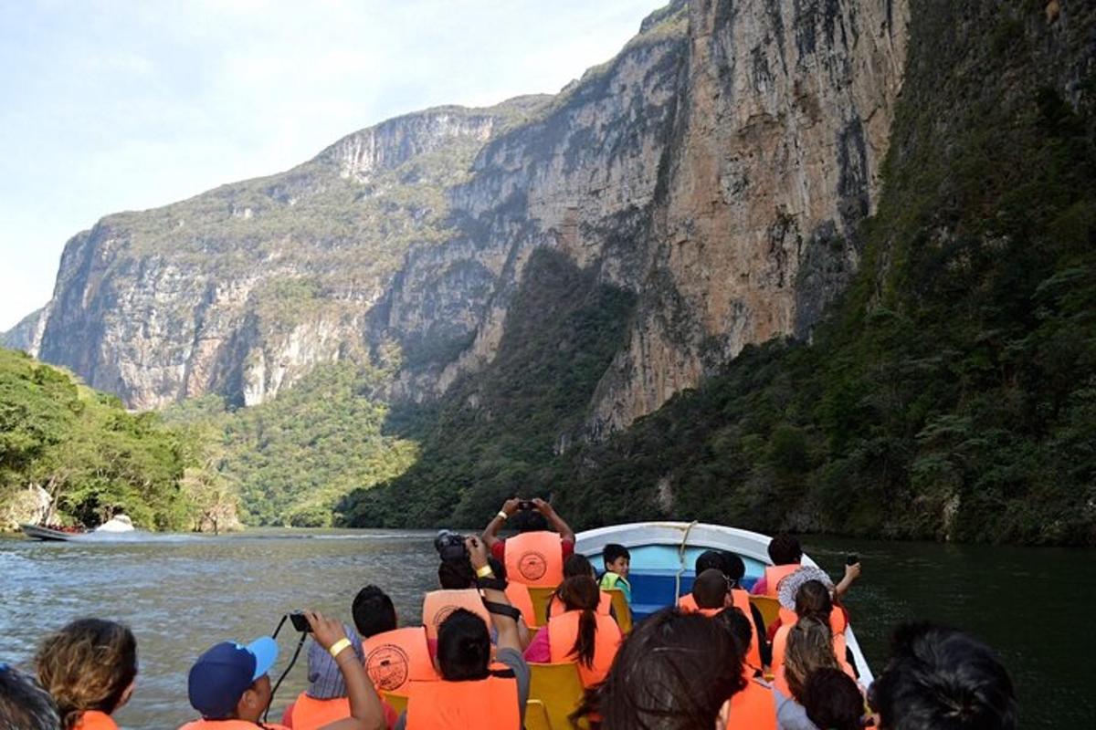 a group of people on a boat in the water