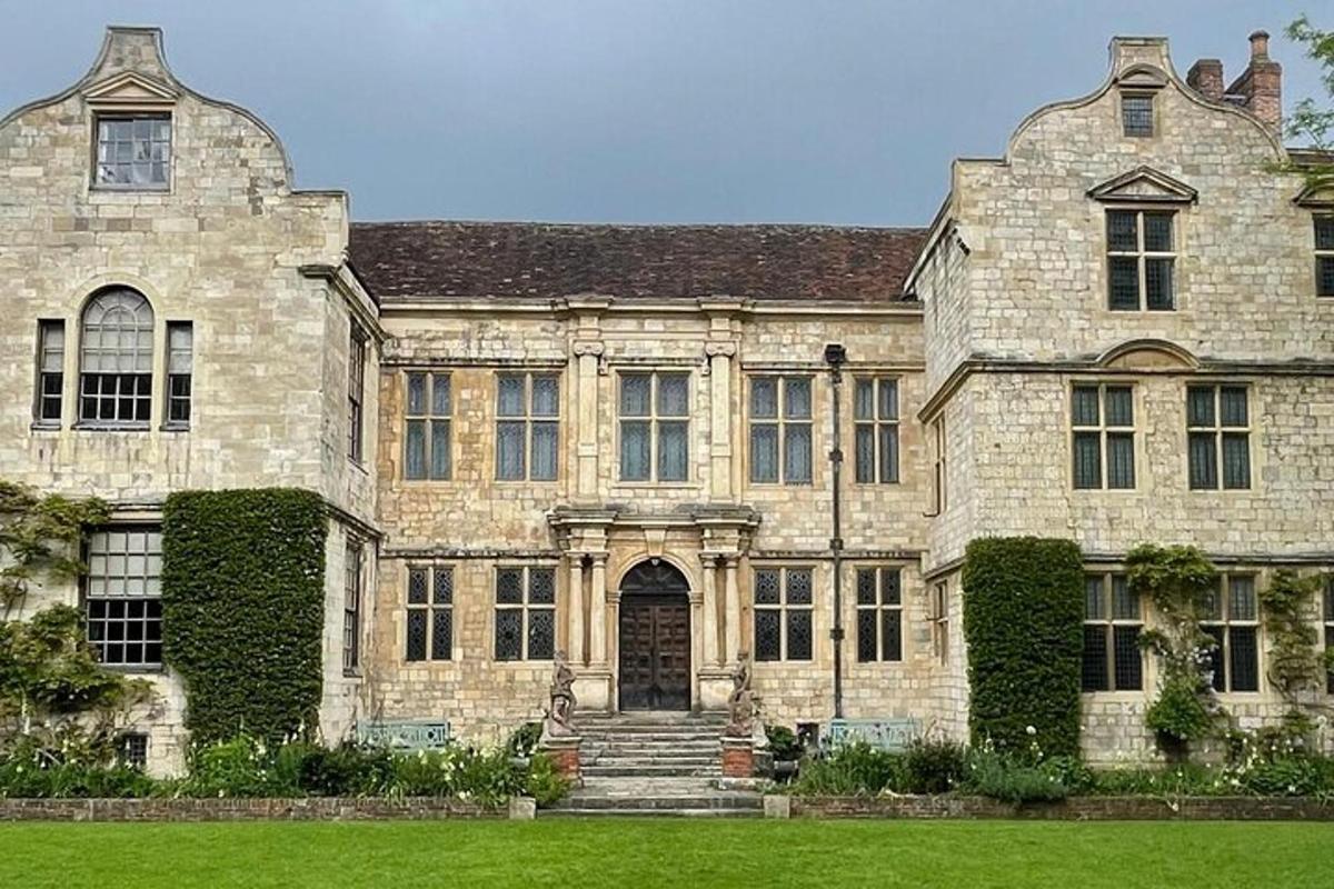 a large stone building with a door and ivy