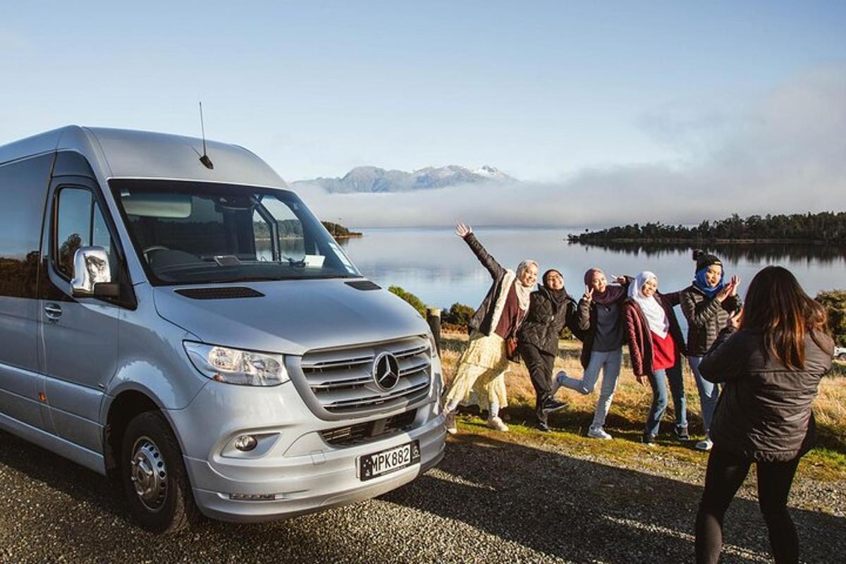 a group of people jumping in front of a van