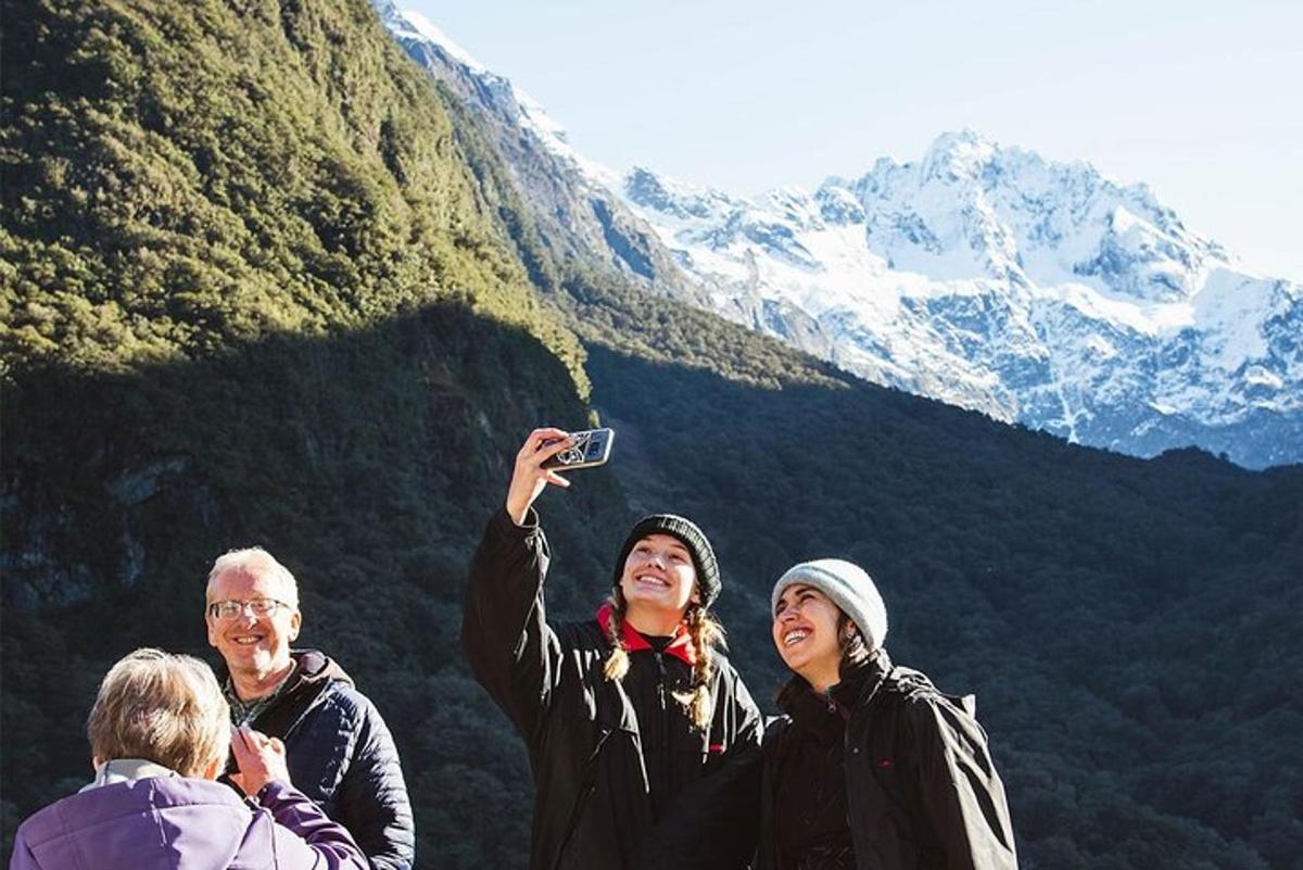 a group of people standing on top of a mountain