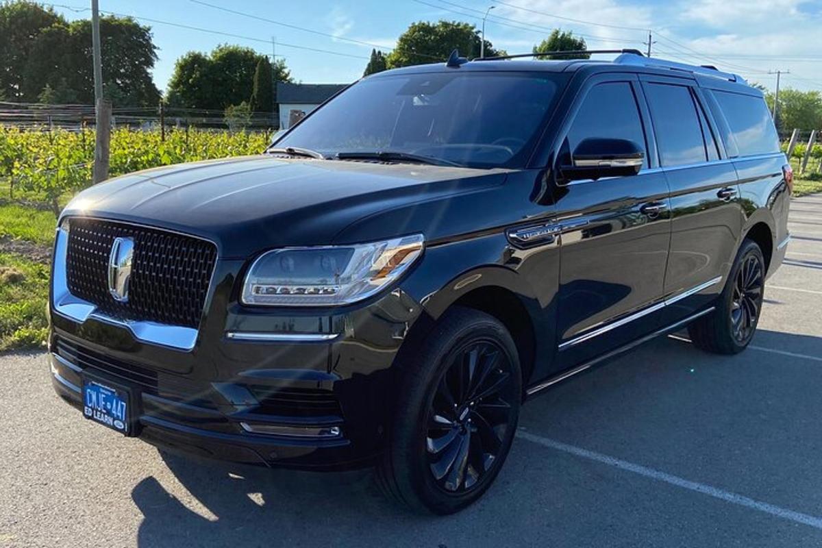 a black suv parked in a parking lot