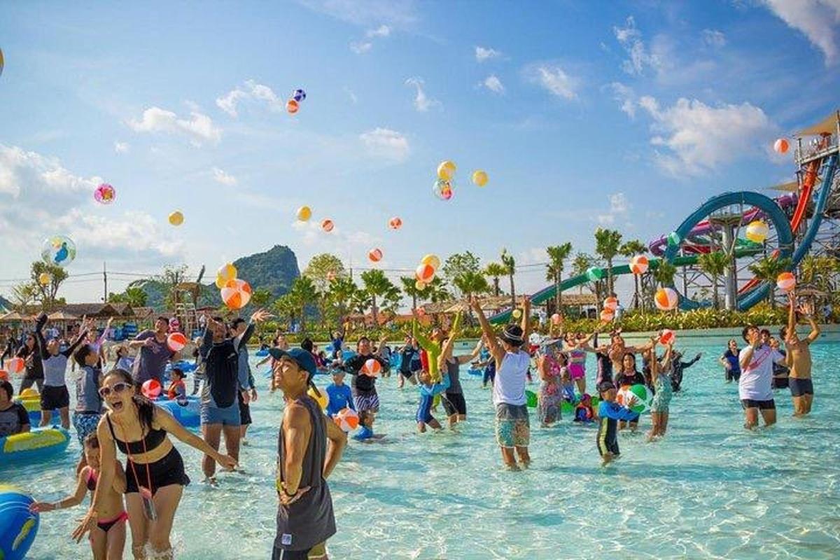 a group of people in the water at a water park