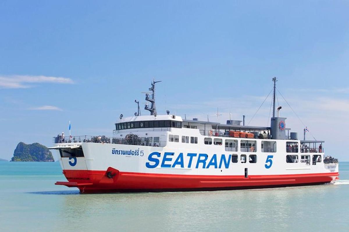a red and white ferry boat on the water