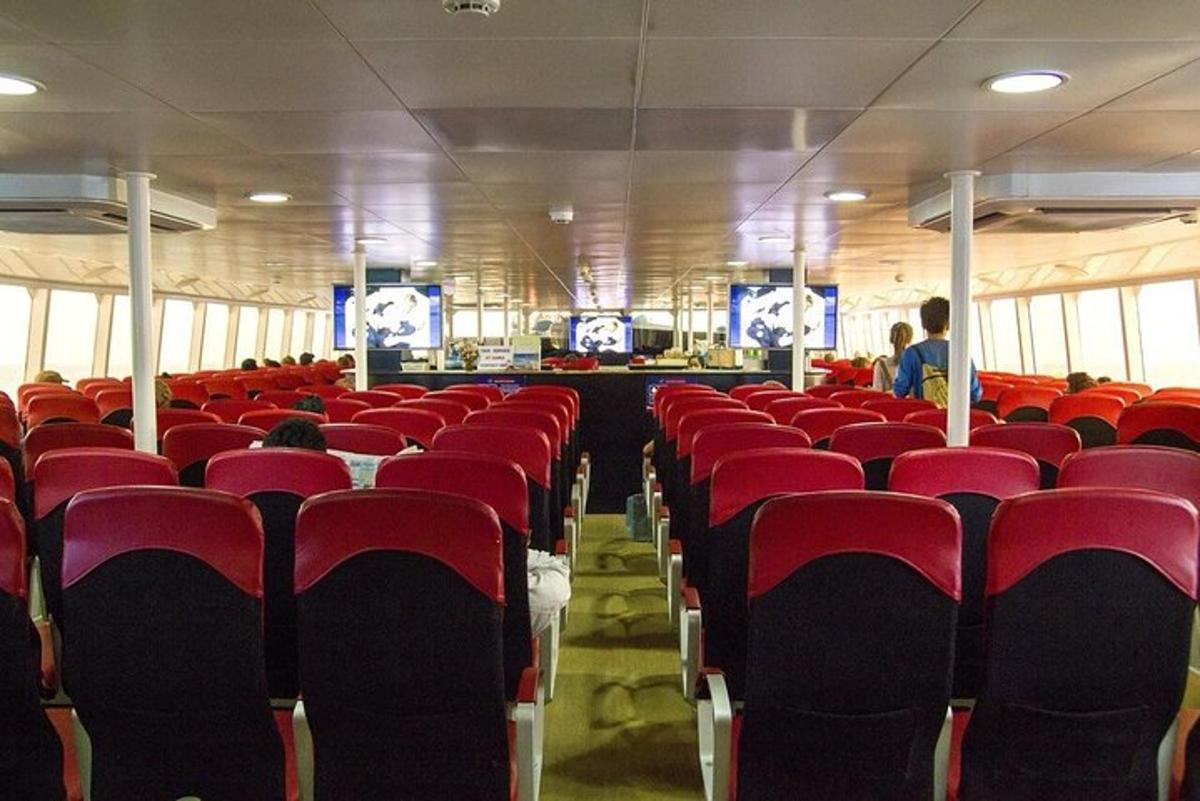 a room with red seats in a bus