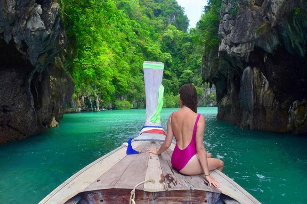 a woman in a bikini sitting on a boat in the water