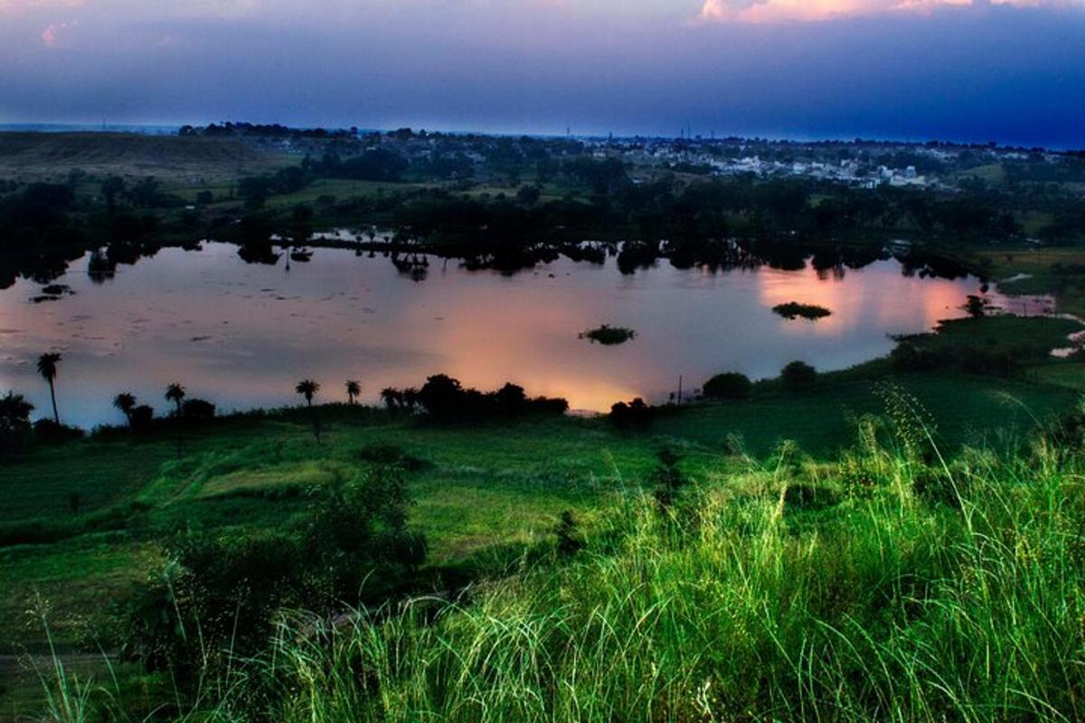 a large body of water with a city in the background