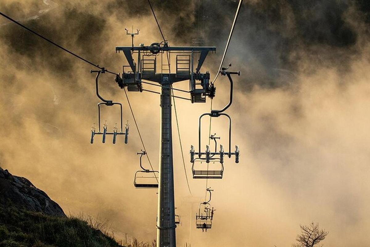 a ski lift with people sitting on it