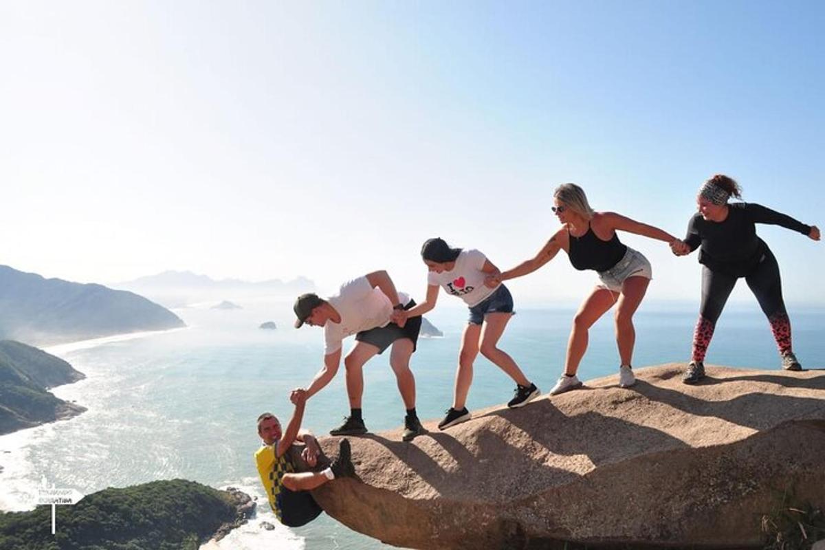 a group of people standing on top of a mountain