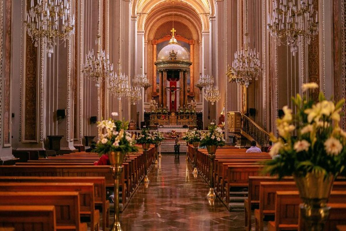 a church with rows of wooden pews with flowers