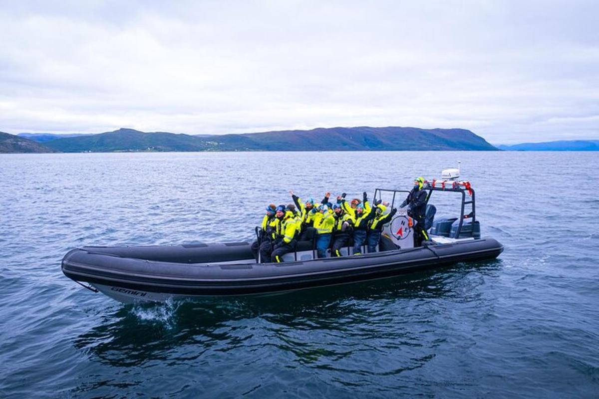 a group of people in a raft on the water