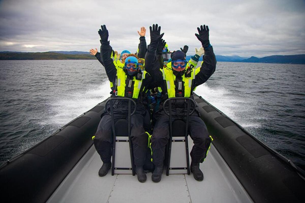 a group of people sitting in a boat on the water