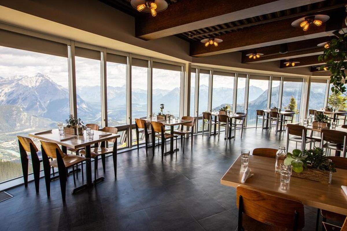 a restaurant with tables and chairs and large windows