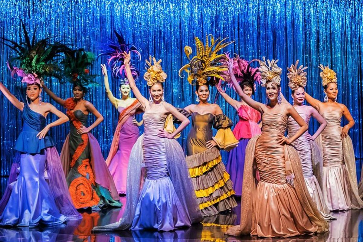 a group of women in dresses on a stage