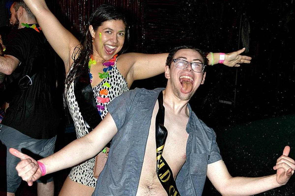 a man and a woman dancing in a party