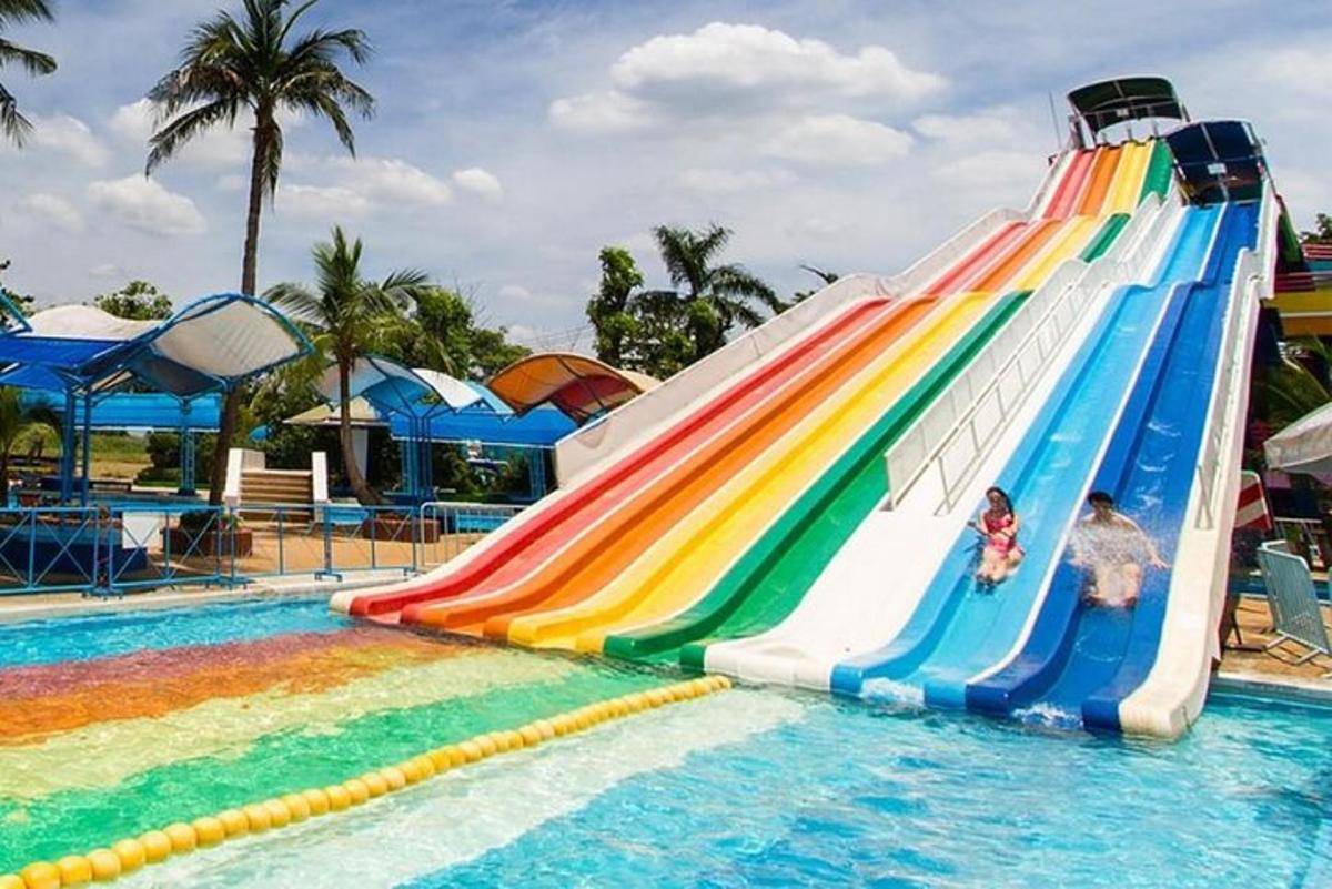 a colorful water slide in a swimming pool